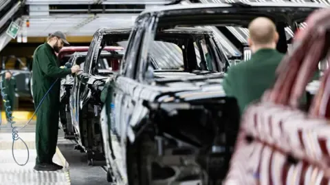 Jaguar Land Rover Vendor Network Workers Allegedly Told to Apply for Government Benefits, Union Claims